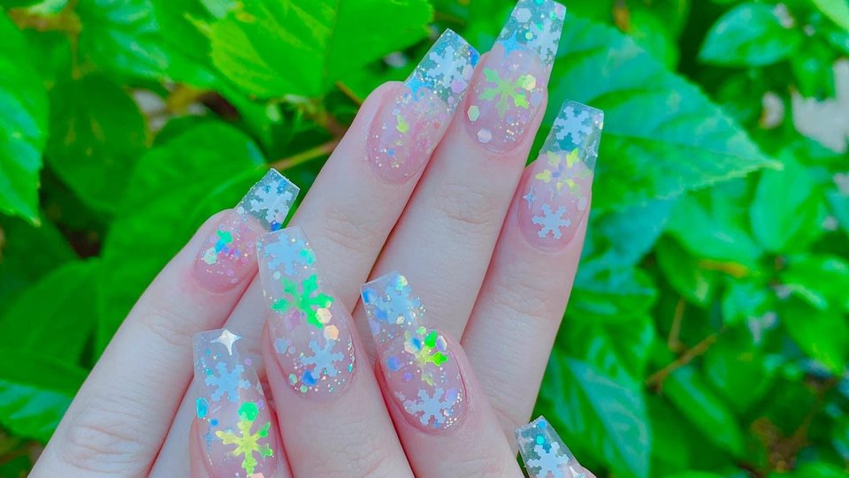 Manicured nails with glossy polish on display.