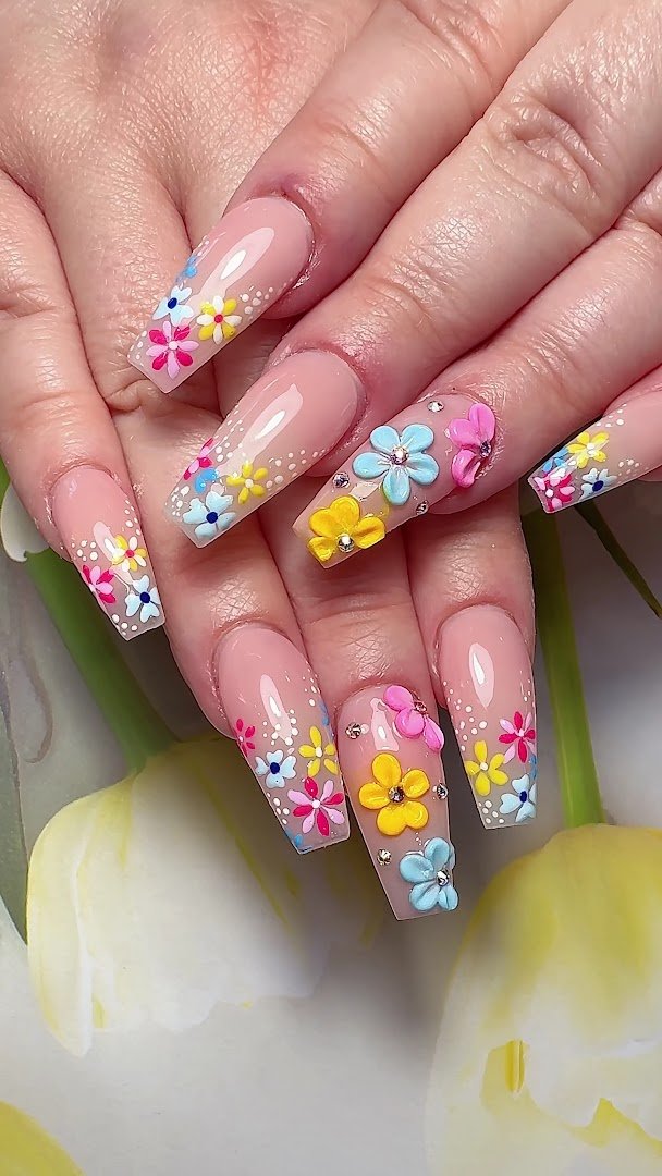 Neatly shaped nails beside soft salon lighting.